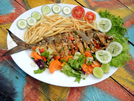 Fried fish Jack with a garnishの写真素材