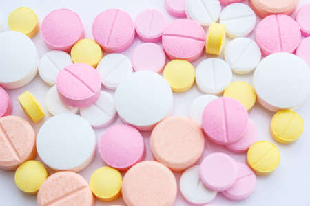 Drug pouring out of medicine bottleの写真素材