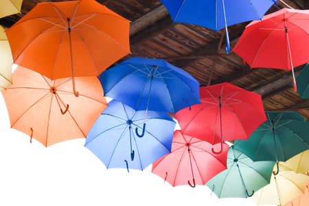 Many bright multicolored umbrellas under ceiling. fun, revelry.の写真素材