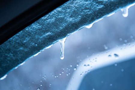 Small icicles hang cold tones. the snow and ice.の写真素材