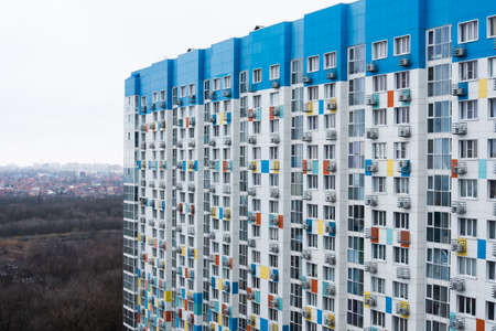 Facade of a multi-storey building. Fragment. Bright and bright house, with air conditioning in each apartment.の写真素材