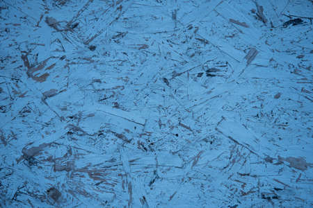 Blue abstract background. Particle Board, piece of wood background, compressed recycled wood Board.