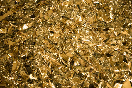 background of Golden sequins close-up. Holiday, postcard background.