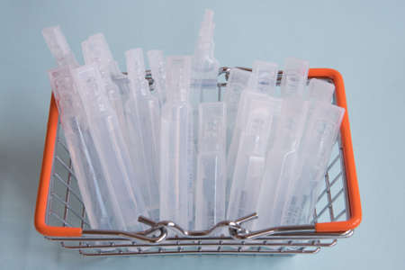 There are medical supplies in the shopping basket. The vaccine for coronavirus. The concept of the...