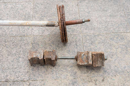 Home-made weight and barbell. Home quarantine and isolation. Equipment for sports from improvised means. healthの写真素材