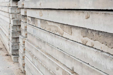 A lot of concrete slabs that are stacked in a row. Side view. Backgroundの写真素材