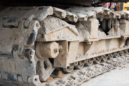 Crawler tractor close-up. Metal wheels. Background, texture.