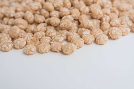 Balls for Breakfast, a side view. background. Beige shades.