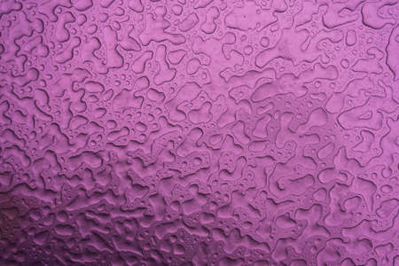 Abstract illustration. Lady or raindrops close up. Macro, strong magnification. Background. An intense pink color.の写真素材