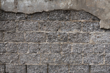 The texture of the old wall from a cement block. Rough gray surface. Concrete structureの写真素材