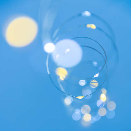 Texture of New Year or Christmas garland on a blue background. Abstract paintingの写真素材
