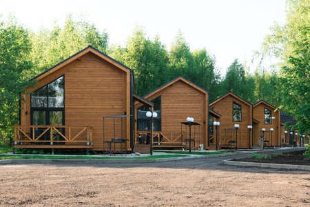 Barnhouse style houses. A street with cozy small houses. Modern constructionの写真素材