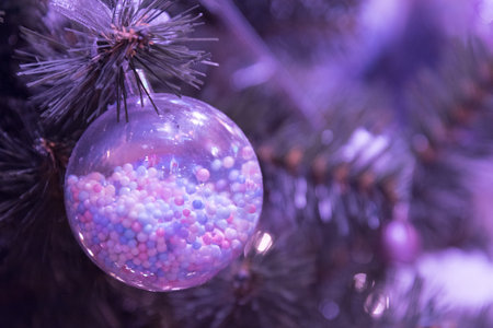 A magic Christmas ball with small balls inside. Christmas card in the trendy shade of 2022.の写真素材