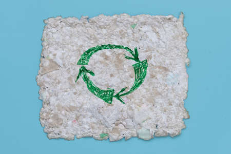 Fragment of recycled paper. Texture, background. Paper elements are clearly visible. The concept of...