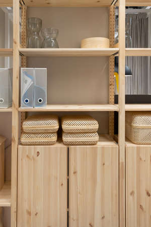 Natural eco-friendly materials in the interior. Wooden shelf and drawersの写真素材