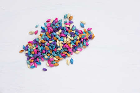 A bunch of colorful shells, top view. White background. background and texture. The concept of vacation, travel to the seaの写真素材