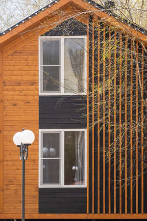 Barnhouse facade element. Bright stylish home. panoramic window. Blue skyの写真素材