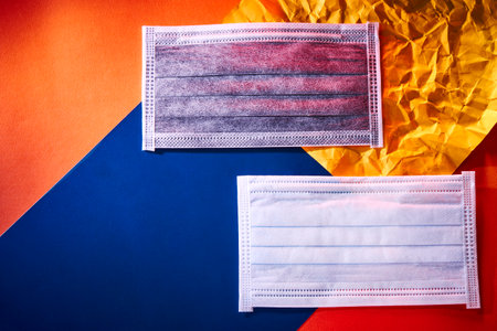 Medical mask or surgical earloop mask on Colorful paper backgroundの写真素材