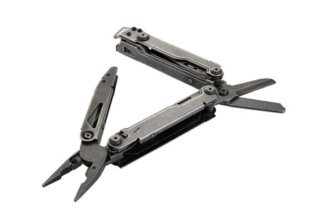 Stainless steel multi tool isolated on white background with clipping path. Foldable multifunction...