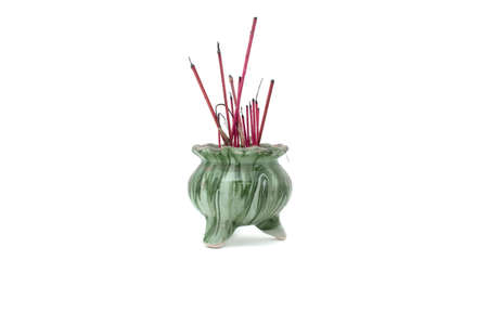 Green ceramic with marble texture joss stick pot with some burnt joss sticksの写真素材