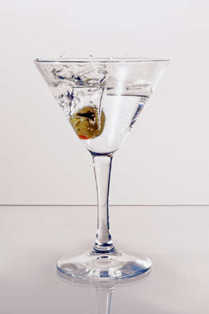 Martini glass with an oliveの写真素材
