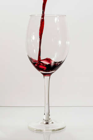 Red wine pouringの写真素材