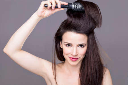 Women brushing hairの写真素材
