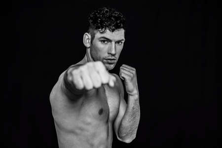Handsome man boxing in black and whiteの写真素材
