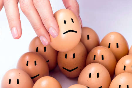 Selected egg feeling sad from other onesの写真素材