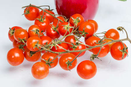 Cherry tomatoes on a white backgroundの写真素材