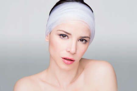 Beauty shot of a woman with a white stripeの写真素材