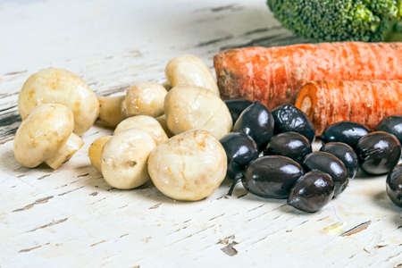 Mushrooms black olives and broccoliの写真素材
