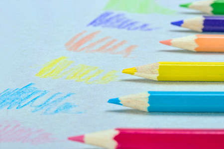 Multicolored crayons sketching on a paperの写真素材