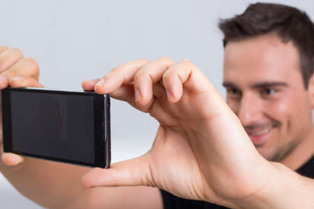 Man taking a selfieの写真素材