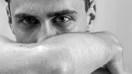 Dark portrait of a man in black and whiteの写真素材