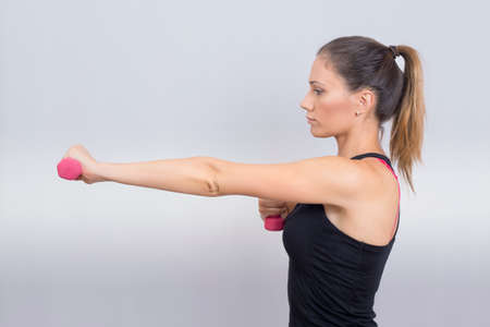 Woman working out in studioの写真素材