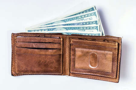 Dollar bills in a wallet