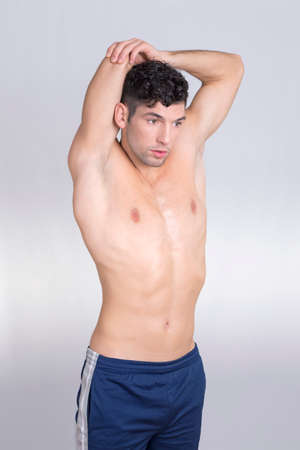 Man stretching in studioの写真素材