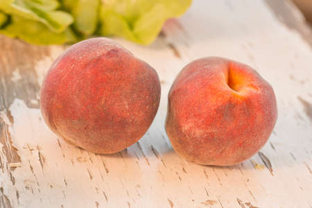 Two organic peaches in a vintage shotの写真素材