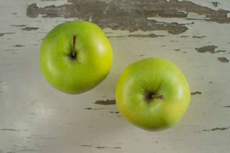 Two green applesの写真素材