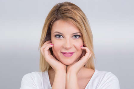 Beautiful blonde woman smiling, beauty shotの写真素材