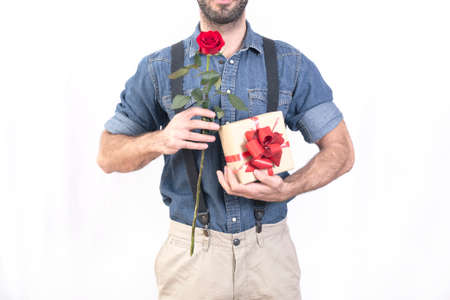 Valentines day man with a red rose and a giftの写真素材