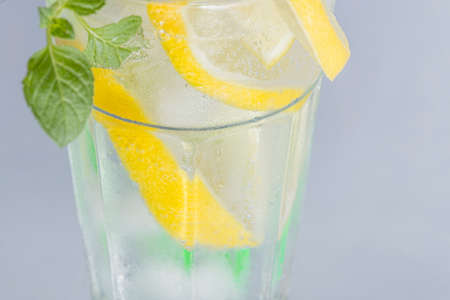 Closeup of refreshing soda with lemon slicesの写真素材