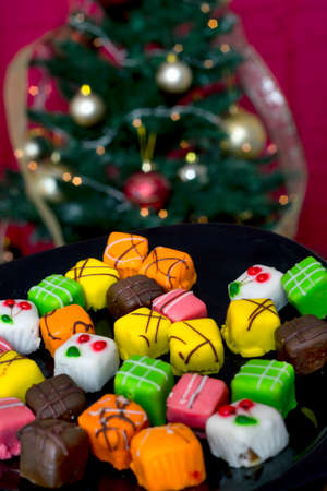 Christmas cakes before a Christmas treeの写真素材