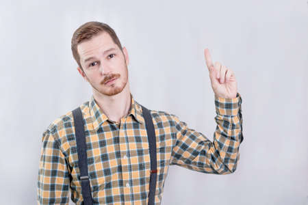 Man pointing his finger up