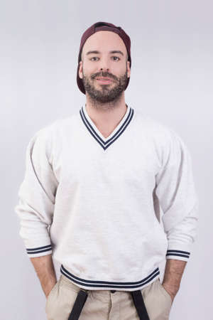 Man with a baseball cap in studioの写真素材