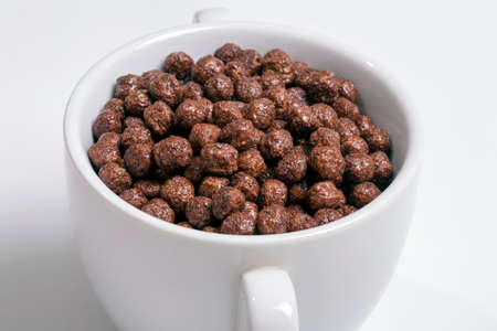 Chocolate cereals in a cupの写真素材