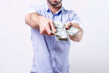 Man showing dollar billsの写真素材