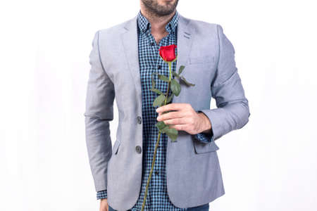 Man holding a red roseの写真素材