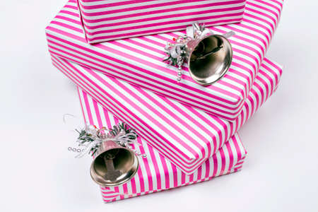 Pink Christmas gifts and bellsの写真素材